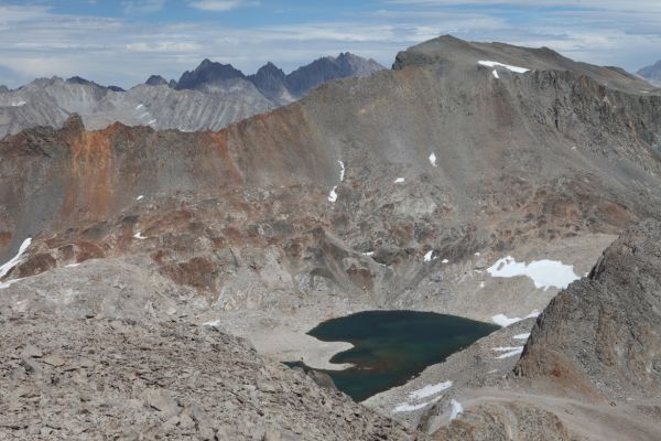 Due east, from the summit of Mt. Solomons, Lake 11939 at the base the Black Giant and the Black Divide.  On the Sierra Crest in the distance are Mt. Johnson, Mt. Goode, Mt. Agassiz (13,891'), and Mt. Winchell (13775').
