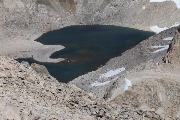 Due east, from the summit of Mt. Solomons, Lake 11939 at the base the Black Giant and the Black Divide.
