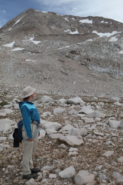 The professor looks back toward the saddle below the west ridge of Mt. Solomons, the route we just descended.
