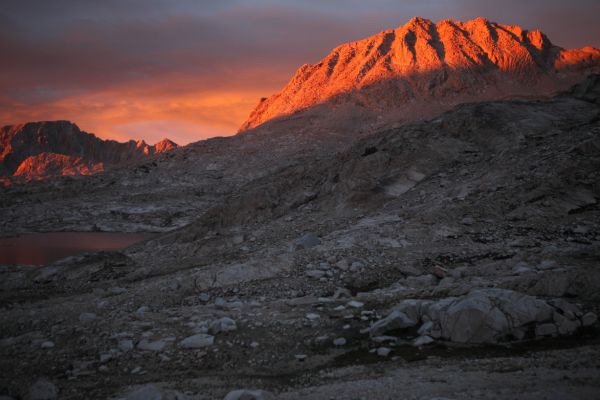 The shadows creep up from the basin floor to put out the intense light, leaving a more subtle glow.  Mt. Huxley, at 13117' remains in direct light longer than many of the surrounding peaks.
