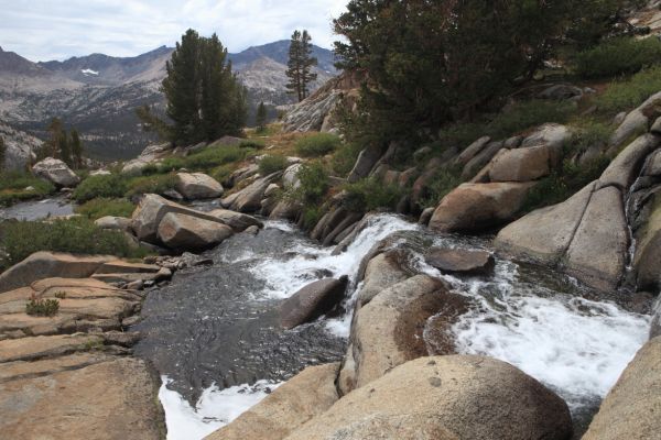 Stream cascades toward Evolution Creek in Evolution Valley from the Darwin Bench.
