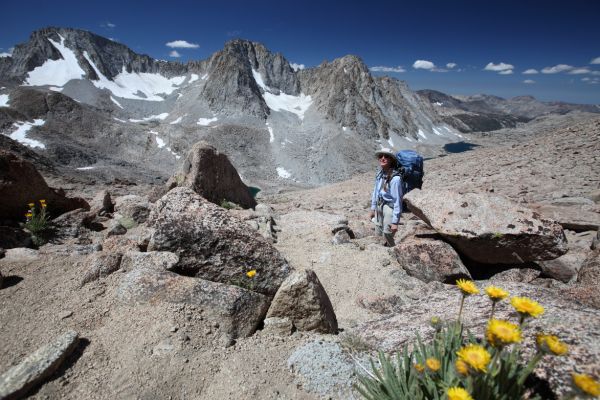 The professor catches her breath on the ascent to  Lamarck Col.  Mt. Darwin and Mt. Mendel across Darwin Canyon to the southwest.
