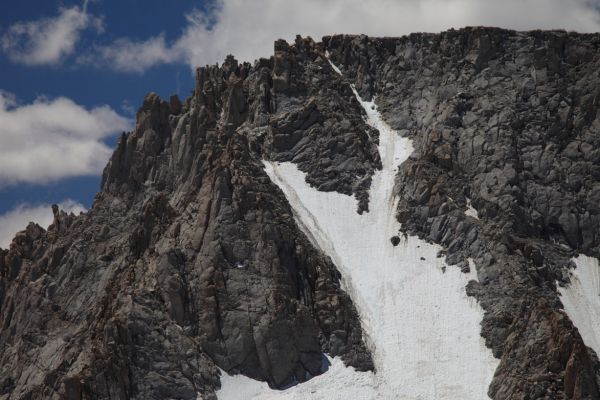 The north face of Mt. Darwin (class 3-4).  I climbed the broad couloir to the left of the rib to the summit plateau in the early 80's.  My two companions preferred the rock rib.
