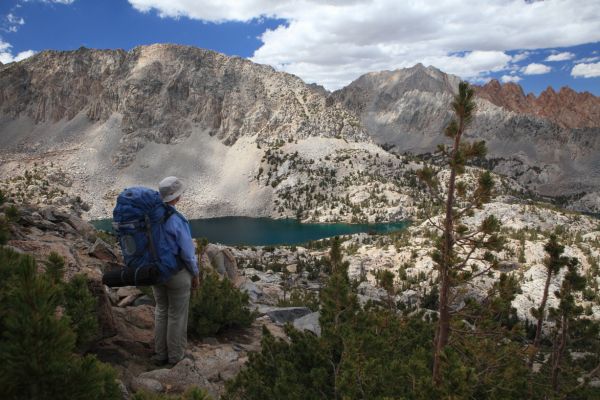 After descending along the east slope below Peak 12373, the use trail crosses onto the northeast ridge descending from the minor peak, with a fine view of Upper Lamarck Lake.
