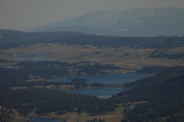 Island Lake and boat dock, in the smokey distance from Lonesome Mountain's south summit.
