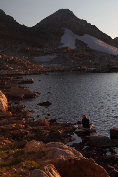 It takes longer than expected to reach Donelson Lake at 10400'.  Elisa pumps water in the setting sun while I start the stove to cook our first course of dinner.
