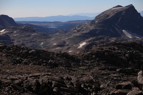 A medium telephoto view (109 mm) all the way back (southeast) to Island Lake's boat launch site.  Lonesome Mountain is on the right.
