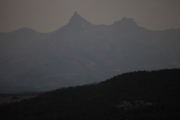 Pilot Peak in the smoke from a viewpoint a few miles east of Cooke City, MT.
