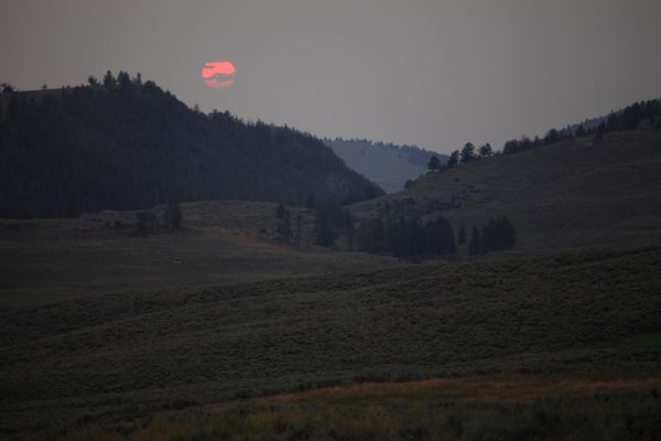 Sun setting into smoke-filled Lamar Valley, Yellowstone.
