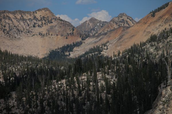 Northeast from the top of the saddle between Ardeth and Spangle lakes to Sand Mountain Pass (hidden right of center).  Imogene Lake lies behind the low gap (left of center) in front of the distant peak and clouds on horizon.
