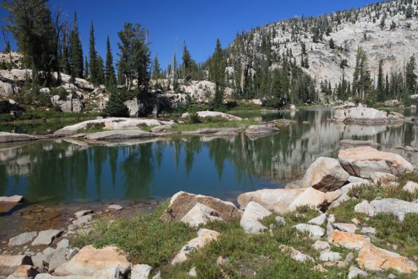 We met a day hiking party of 4 who had come down the slope in the background from Edna Lake.  We had seen them our first night out camping at the south end of Edna Lake.  They were not thrilled with the route they had chosen, and were headed to the trail for the return trip to Edna; Ten Lakes Basin at 8881'.
