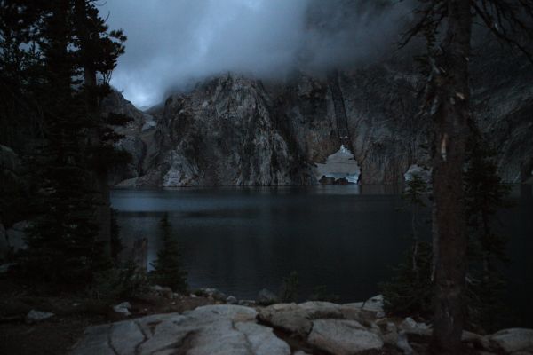 While cooking dinner, the clouds descend to the lake.  Within minutes it is pouring rain.  We eat dinner comfortably in the tent, having made the correct decision.  It rains for an hour and a half, stopping long enough to hang our food, and get ready for bed.
