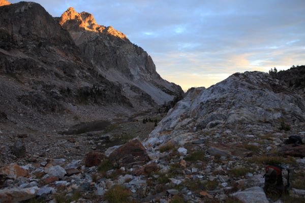 Just after 7 am Sunday morning, we are off to climb Thompson Peak.  Behind us, the first rays of sun hit Peak 10312 south southwest of Goat Lake.
