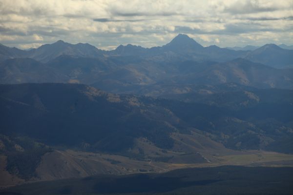 From the summit of Thompson Peak, Castle Peak, 11,815', the highest peak in the White Cloud Mountains towers above the Stanley Valley to the east.
