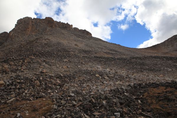 Looking back to the south, southeast to the Thompson/Mickeys Spire Saddle.  The summit of Thompson Peak is up and left (northeast) of the saddle.
