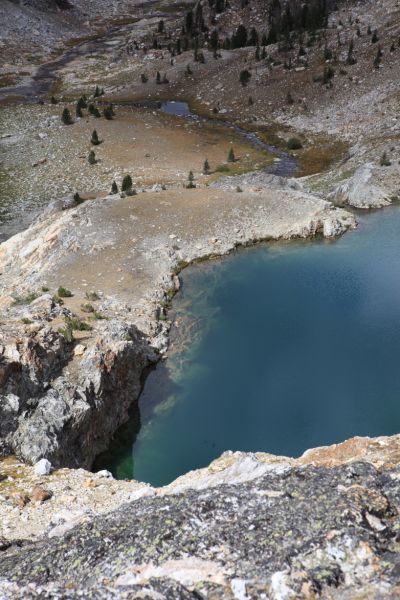 The deep lake high in the lake basin south of Goat Lake.  There is a waterfall at its outlet, but you will have to go there to see it.  This is the second trip we've taken here, and I still have not photographed it.  The professor declined the opportunity to be photographed standing next to it.
