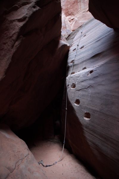 On the river left side we discover one route (as seen from below) consisting of a fixed rope and chopped steps.
