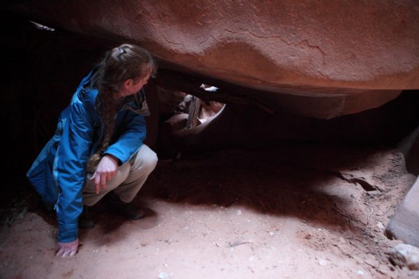 In the middle of the slot is the Rabbit Hole, a tunnel under the house-size boulders.  We are fortunate in that the passage is not blocked by debris, and scurry through.
