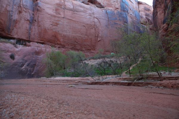 Just downstream there is another narrow spot with a low ceiling.  A rusting steel barrel is jammed in the crack above.
