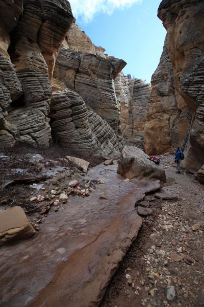 A short distance into Lick Wash, we enter the slot.  There is mud on top of ice, up, out of the streambed.
