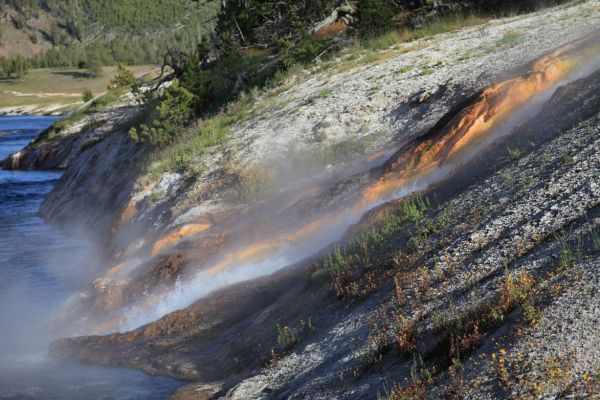 The Excelsior Geyser pool discharges 4,000 to 4,500 gallons of 199 Â°F water per minute directly into the Firehole River; Midway Geyser Basin.
