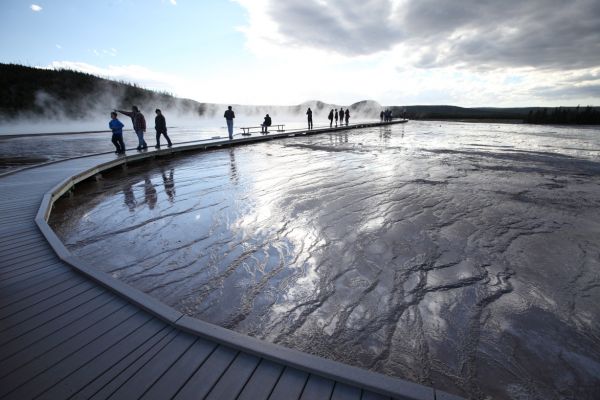 Steam and reflections along the Boardwalk heading west to Grand Prismatic Spring; Midway Geyser Basin.
