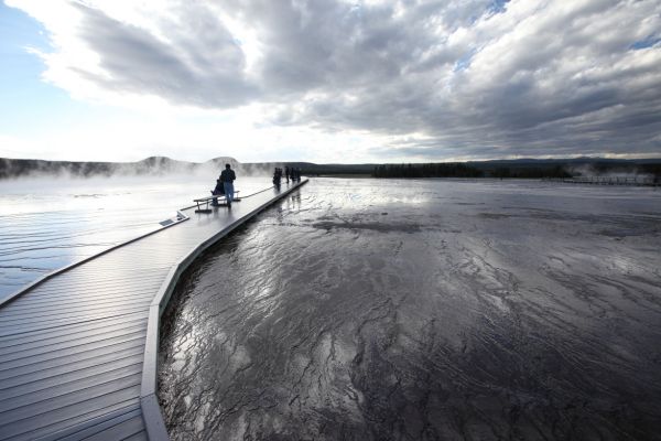 High clouds combine with glare from steam and runoff from Grand Prismatic Spring, barely visible on the left; Midway Geyser Basin.
