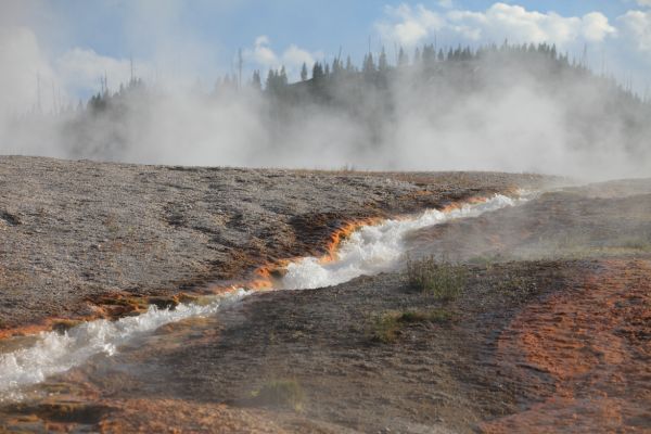 The Excelsior Geyser pool discharges 4,000 to 4,500 gallons of 199 Â°F water per minute directly into the Firehole River; Midway Geyser Basin.
