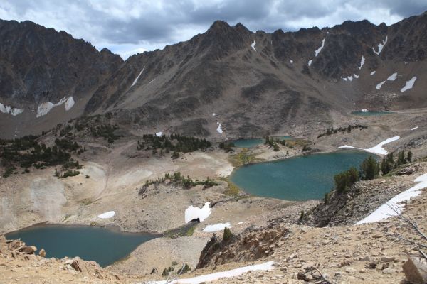 Four Lakes Basin from the saddle to the north.  I had to wait several minutes for direct sunlight on the lakes.
