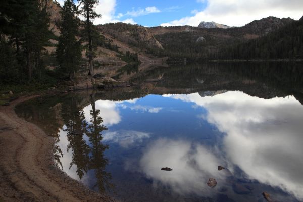 Still water on Quiet Lake; no trout rings.  I walked to a deep drop off on the east side of the lake where I fished with no luck the evening before, and came back empty handed again.
