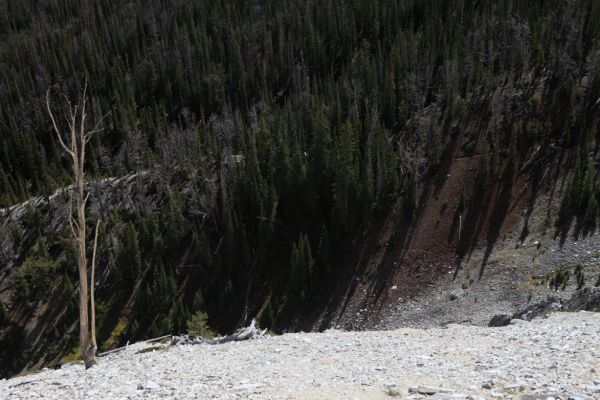 The jeep trail climbing the ridge past the cabin (upper one third of frame, one third from left edge of frame) viewed from the footpath to Castle Lake.  A mine shaft is located past the cabin after road narrows to a trail (about one quarter from right edge of frame).
