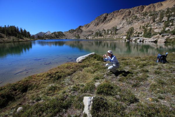 Photographing the upper Chamberlain Lake (9849').   Directly over that ridge behind the Professor is Washington Lake.  It seems we could have saved ourselves considerable time by traveling cross country.  There is considerable uphill encountered on the trail once it turns north along Washington Creek.  Looking at the map, there does not seem to be much gain.  That trail, however, felt steep to me.  Perhaps it was because I was under the mistaken impression it was mostly downhill to Fourth of July Lake.
