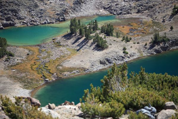 I love the alpine character of this basin, and would like to stop and fish here, but I am trying to get to Scree Lake today and it is already 3:40 pm.  Inevitably, I arrive here late in the day, and the wind always seems to be ripping across the water.  I resolve to stay here my last night.
