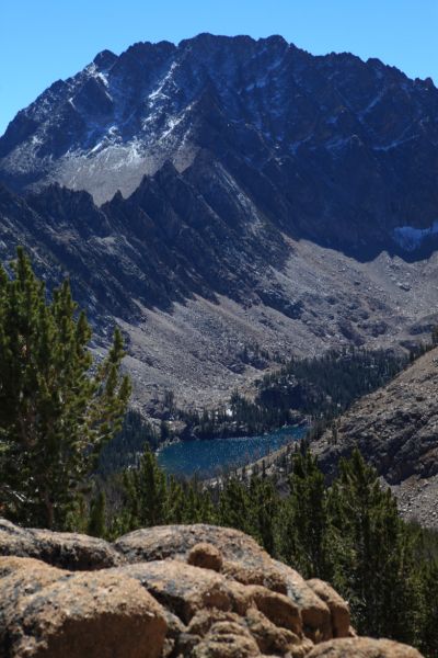 Crossing Windy Devil, Quiet Lake, far below the north face of Castle Peak and the Serrate Ridge, comes into view.
