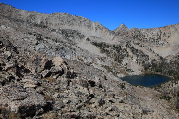 Hidden high above and west of Scoop Lake, not yet visible, is Lonesome Lake.  On the descent, I meet two women inquiring about the cross-country route I have just traversed.  They plan to go out the same way I have just come in.
