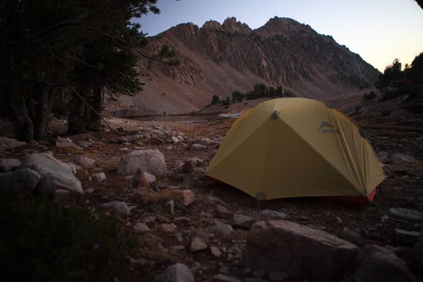 Camp at Four Lakes Basin around 7 am, just before the first rays hit the surrounding peaks.
