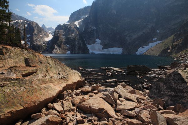 The outlet of Goat Lake.  Thompson Peak is the distant peak left of the couloir rising above the far end of the lake.  Mickey's Spire is directly above the couloir.  Thompson Peak is ascended from the saddle between the two.
