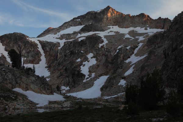 I persuade my companion to continue on to the beautiful meadows beyond the lake.  Alpenglow puts a halt to setting up camp to concentrate on photography.
