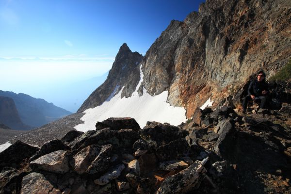 Mike joins me on the Thompson Peak/Mickey's Spire saddle.  To the east, Castle Peak is barely through the haze on the horizon.
