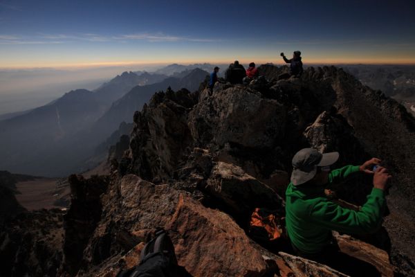 People busied themselves with an array of recording devices.  Many had carried tripods to the summit.  Some held the inexpensive viewing glasses in front of point-and-shoot cameras.
