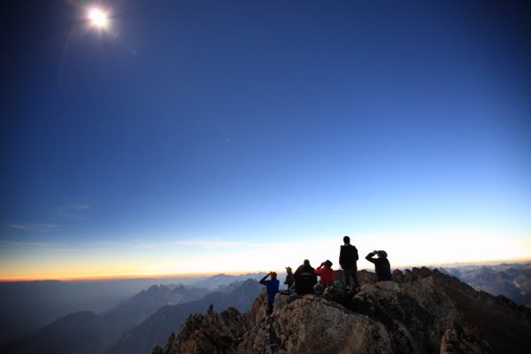 Someone shouts, "The diamond!", and we realize totality has ended.  It gets much brighter. 
