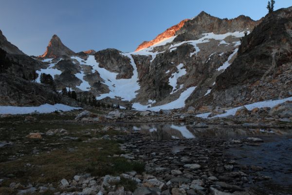 The following morning, alpenglow filters through the smoke in the east to light Thompson Peak from the opposite side.
