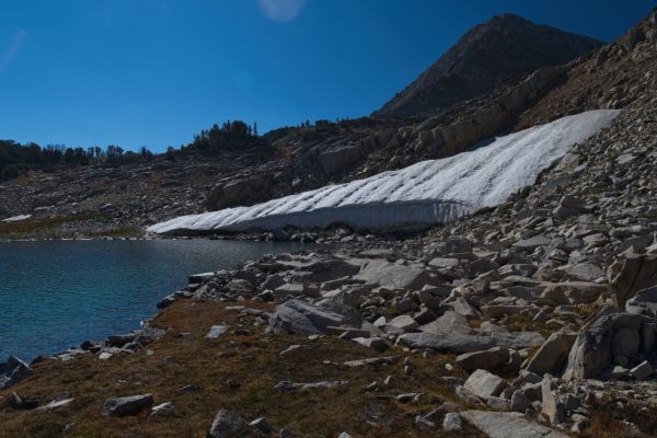 Perennial snow field southwest end of and tarn east of Cove Lake, Big Boulder Lakes.  This begins the cross-country route to Boulder Chain Lakes, the next basin to the south.
