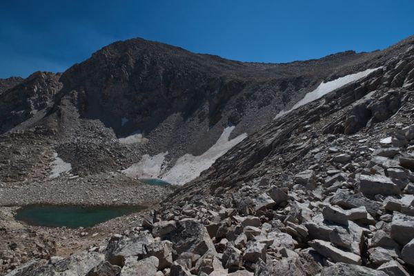 The saddle separating the two lake basins comes into view.
