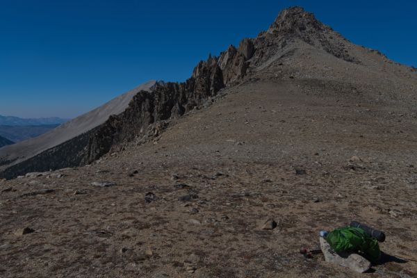 Peak 11072 (right) as seen from the low saddle.  D. O. Lee Peak is seen behind the jagged west ridge (skyline) of Peak 11072.
