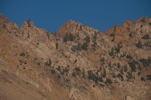 The notch I descended late the day before.  I'm not positive which notch it is; most likely, just left of the outcrop in the center.  The foreshortening effect of the long lens makes it appear worse than it was.
