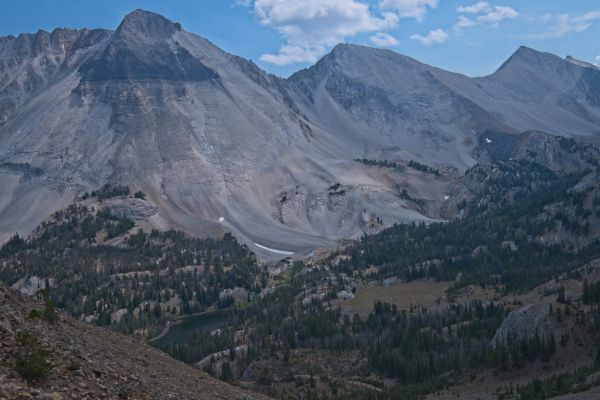 My goal for today is to cross the saddle between WCP9 and D. O. Lee Peak, the second saddle to the right in the frame, due east of Bighorn Basin.  Ocalkens Lake is in the lower left.  In the interest of saving some time, I decide not to descend to the lake, contouring south at an elevation of 9300’ directly into Bighorn Basin.  I still am carrying enough water to get over the saddle.
