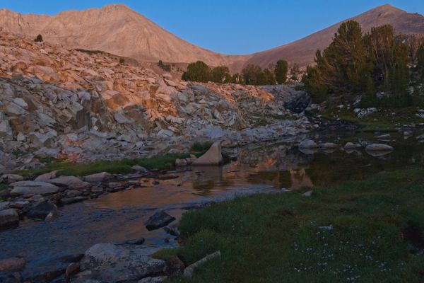 Sunrise; saddle between D. O. Lee Peak and WCP9.  In the foreground,  reflections, inlet stream, Cove Lake.
