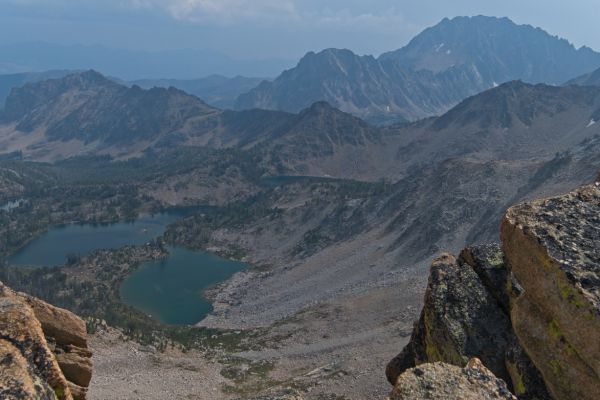 Castle Peak, and the Serrate Ridge rise in the distance to the south.  Scoop Lake (seen below the Serrate Ridge) is the highest Lake one encounters on the trail before climbing south out of the Boulder Chain Lakes basin.
