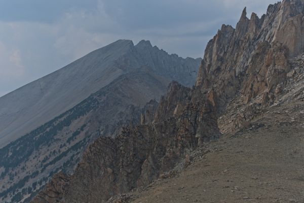 Looking northwest from the saddle between the two Boulder Lake basins past the lower saddle (above the snowfield), D. O. Lee Peak is the most distinctive landmark in the distance.
